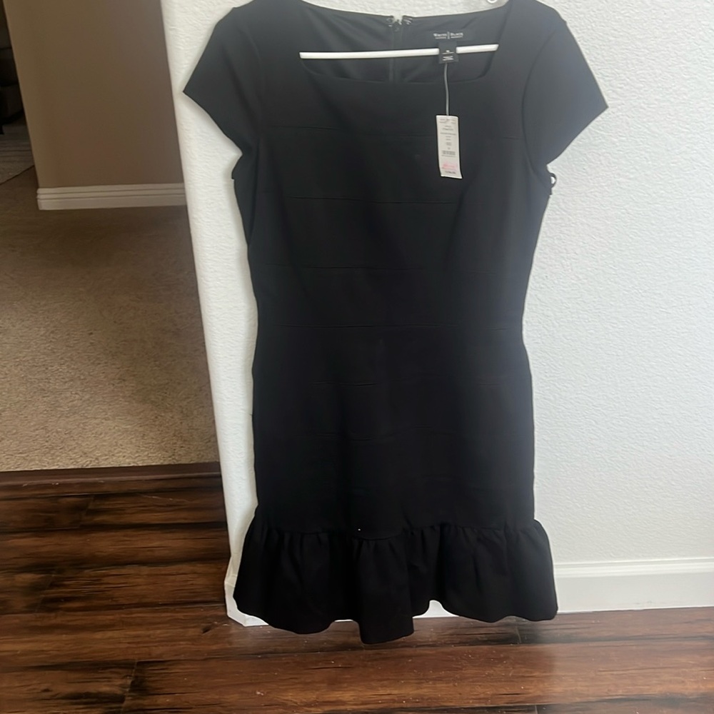 Adorable White House Black Market dress with flounce bottoms.